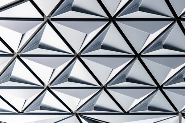 Futuristic silver geometric pattern on a modern building in Toronto.